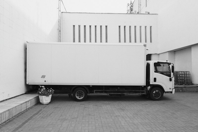 Box truck parked at a loading area