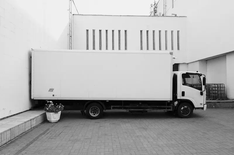 Box truck parked at a loading area